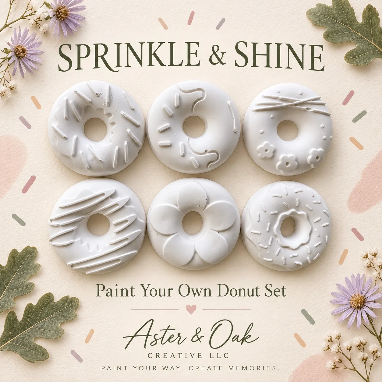 Six unpainted donut-shaped plaster figures with assorted designs